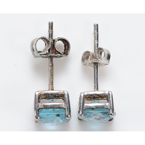 50 - A pair of 9ct white gold blue topaz earrings with scroll backs, 1.3g