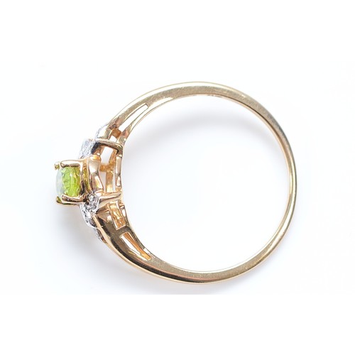 53 - A 9ct gold peridot and single cut diamond dress ring, M 1/2, 1.6g