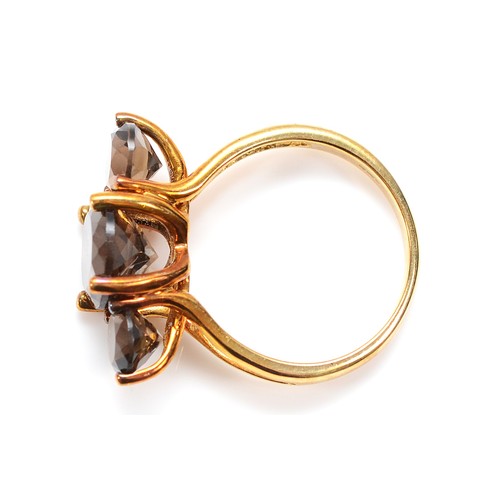 56 - A 9ct gold smokey quartz three stone ring, Birmingham 2007, N, 3.7g