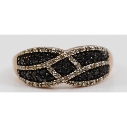 57 - A 9ct gold single cut diamond dress ring, with black diamonds to the centre of the pattern, stated 0... 