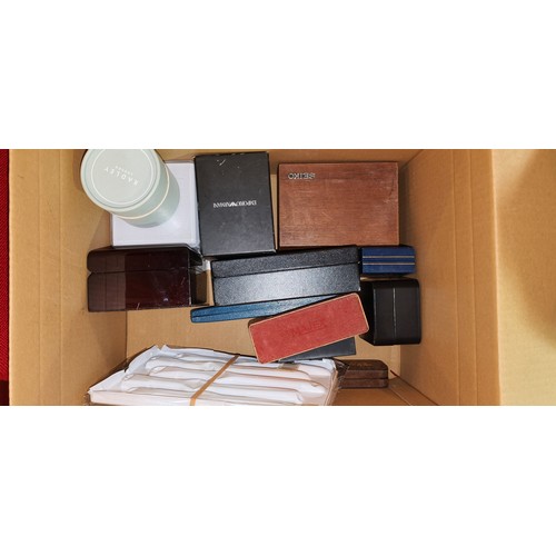 47 - Approximately 25 boxed ladies and gentleman's fashion and smart wristwatches. (in one box)