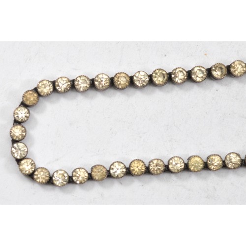33 - A metal and paste necklace, 37cm, with matching bracelet, 19cm