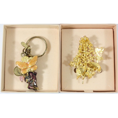 38 - Kirks Folly, a floral brooch and keyring, in boxes