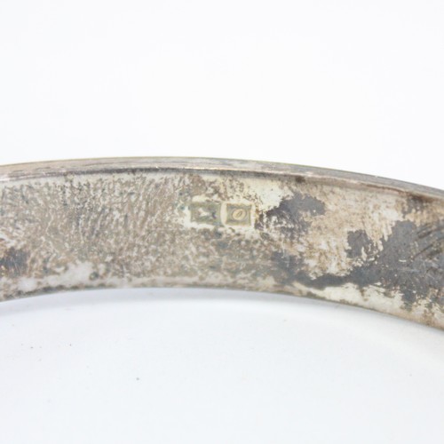 46 - Two silver bangles, 34g, with a quantity of costume jewellery to include brooches, earrings and watc... 
