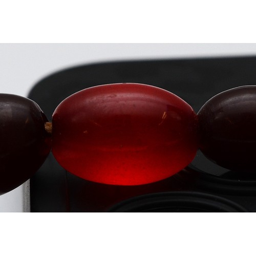 52 - A cherry Bakelite beaded necklace, largest bead 15mm, 46cm, screw closure, 23g