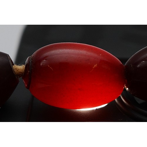 52 - A cherry Bakelite beaded necklace, largest bead 15mm, 46cm, screw closure, 23g
