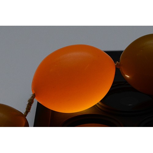 54 - A Bakelite beaded necklace, graduating size beads, largest bead 22mm, screw closure, 95cm, 65g