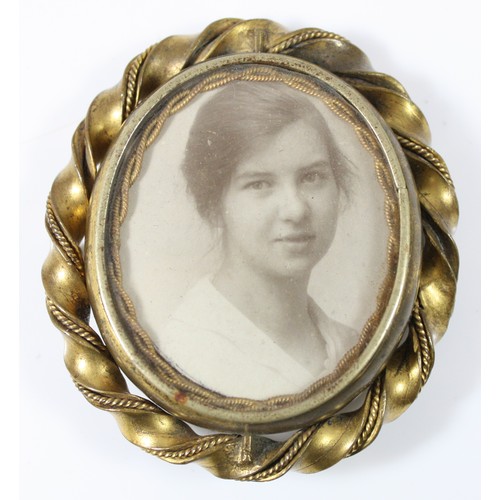 57 - A gold plated spinning brooch, photograph to one side and an agate section to the other, in need of ... 
