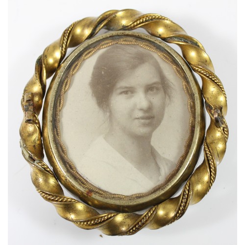 57 - A gold plated spinning brooch, photograph to one side and an agate section to the other, in need of ... 