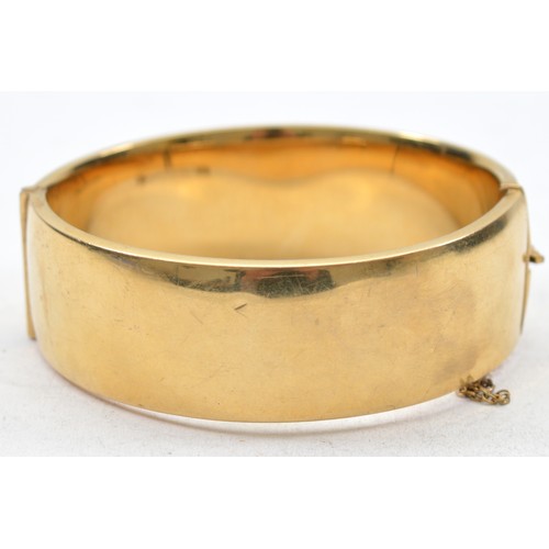 60 - A 1/5 9ct rolled gold hinged bangle, 65mm