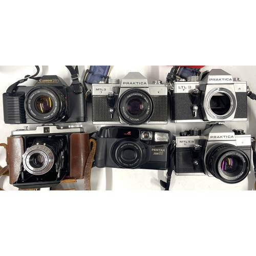 7 - 6 film cameras to include a Praktica MTL B camera with a 50mm lens, a Canon T50 with a 50mm lens, a ... 
