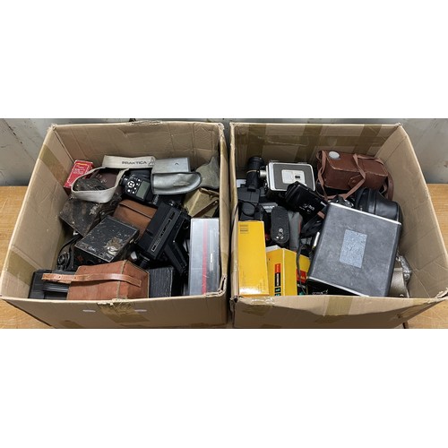 9 - 2 boxes of film cameras to include movie cameras, box cameras, Kodak Instamatics, accessories and mo... 