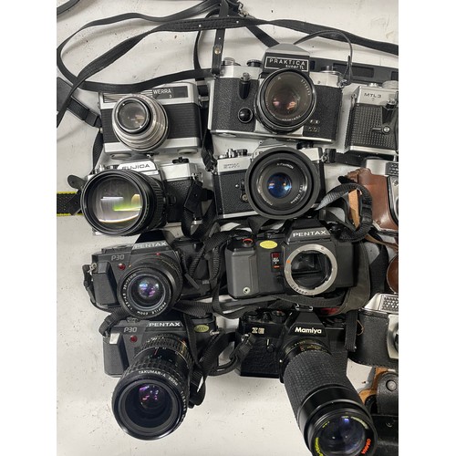 15 - A box of film cameras to include a Mamiya ZE with a Osawa 75-150mm lens, a Pentax A3, a Pentax P30 a... 