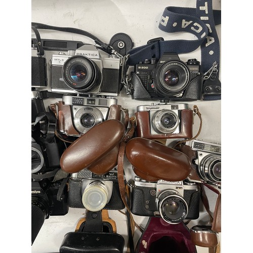 15 - A box of film cameras to include a Mamiya ZE with a Osawa 75-150mm lens, a Pentax A3, a Pentax P30 a... 