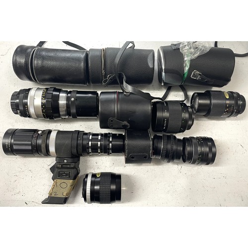 25 - A box of camera lens to include a Nikkor-Q Auto 1:4 200mm lens, a Hanimex 300mm 1:5.6 mirror lens, a... 