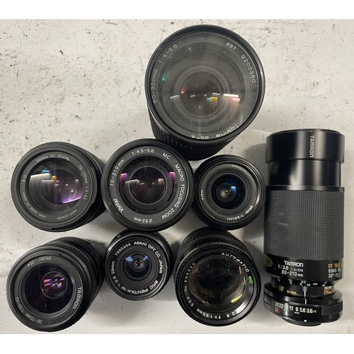 26 - A box of camera lens to include a Agilux Telephoto 16cm F5.5 lens, a Tokina 60-300mm 1:4-5.6 lens, a... 