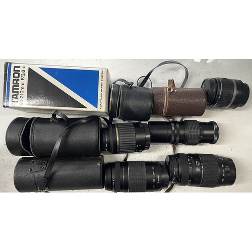 27 - A box of camera lens to include a Tamron 80-210mm 3.8-4 lens, a Canon EF 75-300mm 1:4-5.6 III lens, ... 