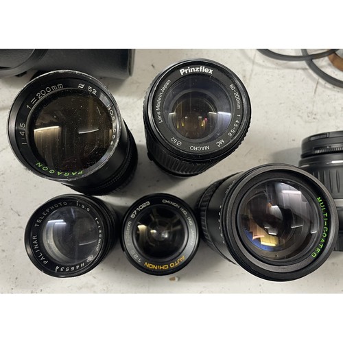 27 - A box of camera lens to include a Tamron 80-210mm 3.8-4 lens, a Canon EF 75-300mm 1:4-5.6 III lens, ... 