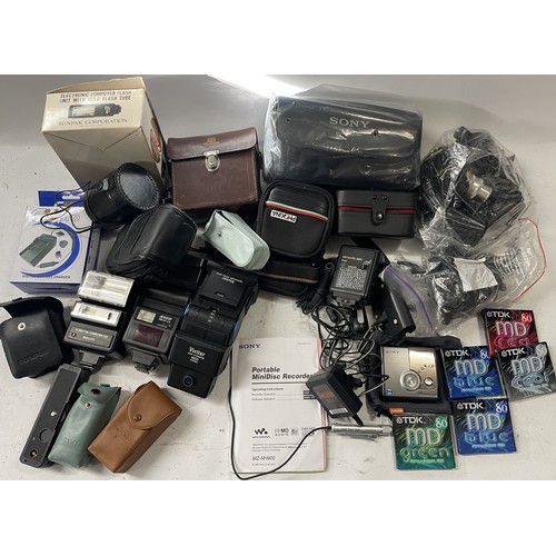 29 - A Sony Mini Disc Walkman MZ-NH900 and a box of camera accessories. (1 box)