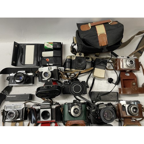37 - A collection of film cameras to include a Praktica B200, a Fujica AX-1, a Praktica Super TL and othe... 