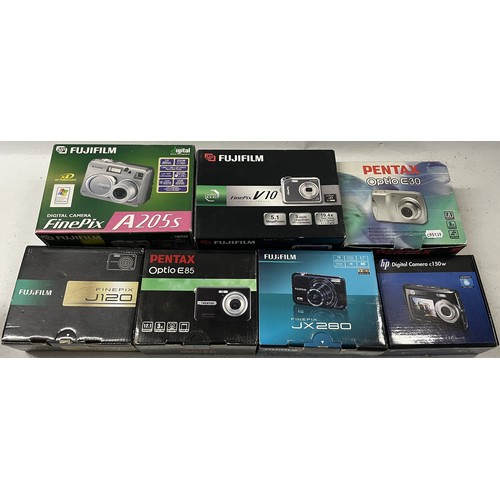 49 - A collection of digital cameras to include, a Fuji Fine Pix J120, a Pentax Optio E30 and a Pentax Op... 