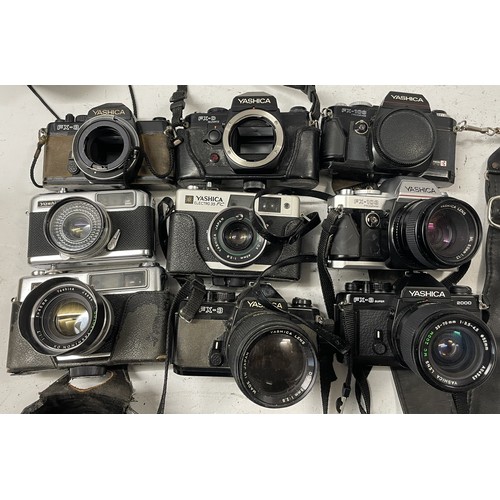58 - A collection of film cameras to include, a Yashica FX-D, a Yashica FX-3 and a Yashica FX-103. (One b... 