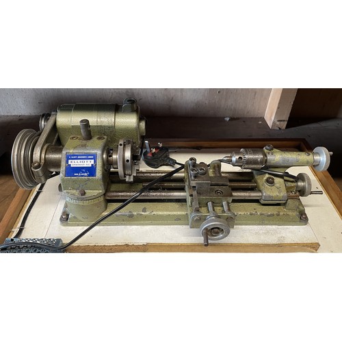 13 - An Elliott Unimat SL mini watchmakers lathe, with a drawer of accessories and cutting tools.
