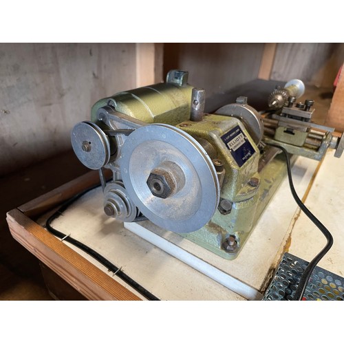 13 - An Elliott Unimat SL mini watchmakers lathe, with a drawer of accessories and cutting tools.