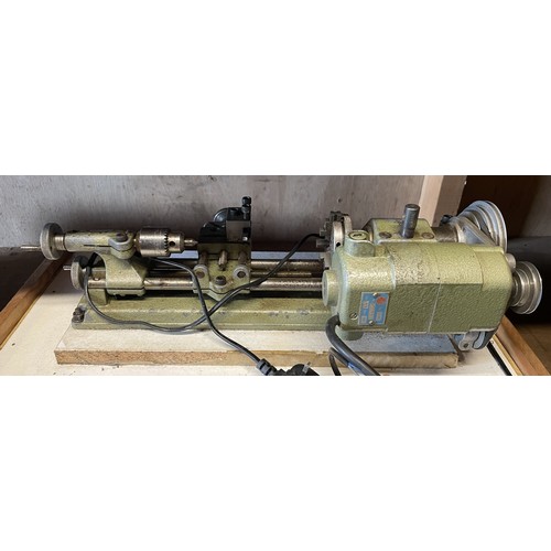 13 - An Elliott Unimat SL mini watchmakers lathe, with a drawer of accessories and cutting tools.