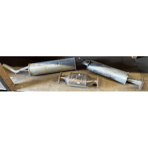 16 - A collection of car parts, predominately late classic Mini parts to include, part exhaust system inc... 