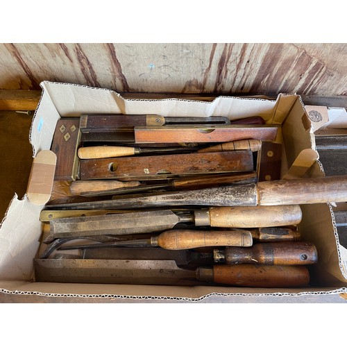 20 - Two boxes of carpenters tools to include, large chisels, gouges, spirit levels and saws. (2)