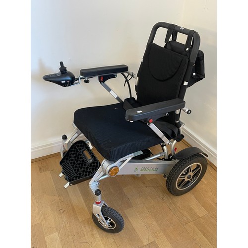 33 - A 'Free To Be' electric wheelchair model NSDS 01-Silver, with charger and instruction manual, used o... 