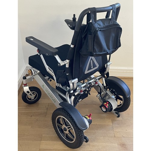 33 - A 'Free To Be' electric wheelchair model NSDS 01-Silver, with charger and instruction manual, used o... 