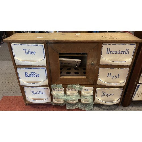 36 - Three vintage wall-mounted wooden spice racks, with assorted ceramic drawers. Some damage and missin... 