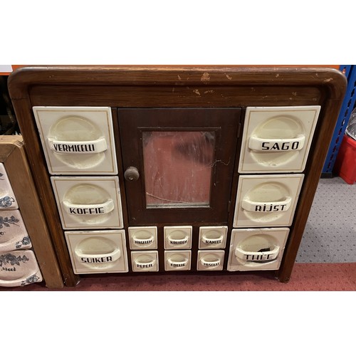 37 - Three vintage wall-mounted spice racks, including ceramic and glass drawer examples. Some damage and... 