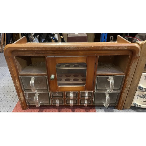 37 - Three vintage wall-mounted spice racks, including ceramic and glass drawer examples. Some damage and... 