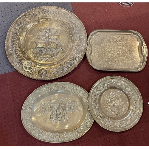 39 - A collection of mid to late twentieth century homewares to include, embossed brass wall plaques, pla... 