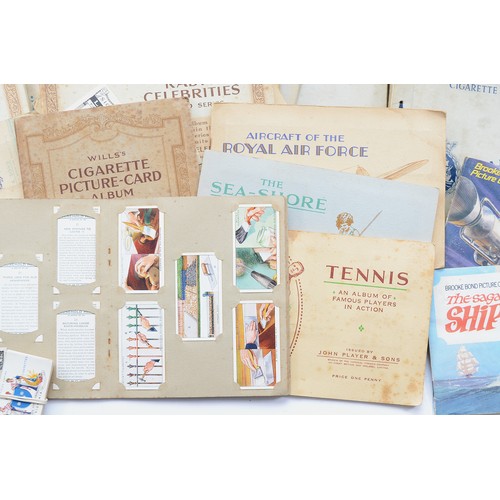 55 - A large collection of mid 20th century pictorial cigarette cards, loose and in albums, in one box.