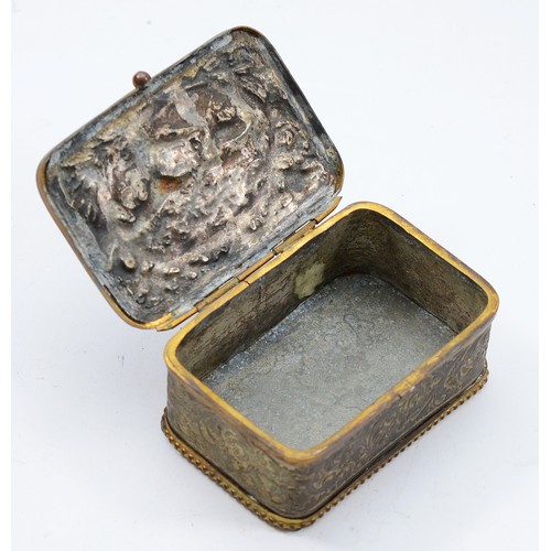 56 - A 19th century French repousse metal jewellery or trinket casket, the hinged lid with detailed relie... 
