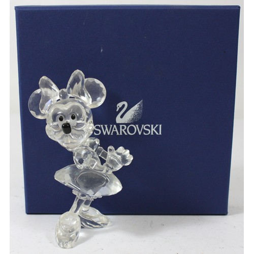A boxed Swarovski Crystal figurine of the Disney character Mini Mouse, model number 687436.