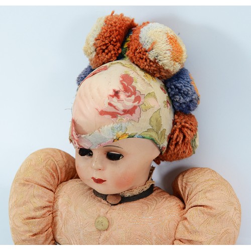A Hungarian matyo folk costume doll with articulated head, arms and ...
