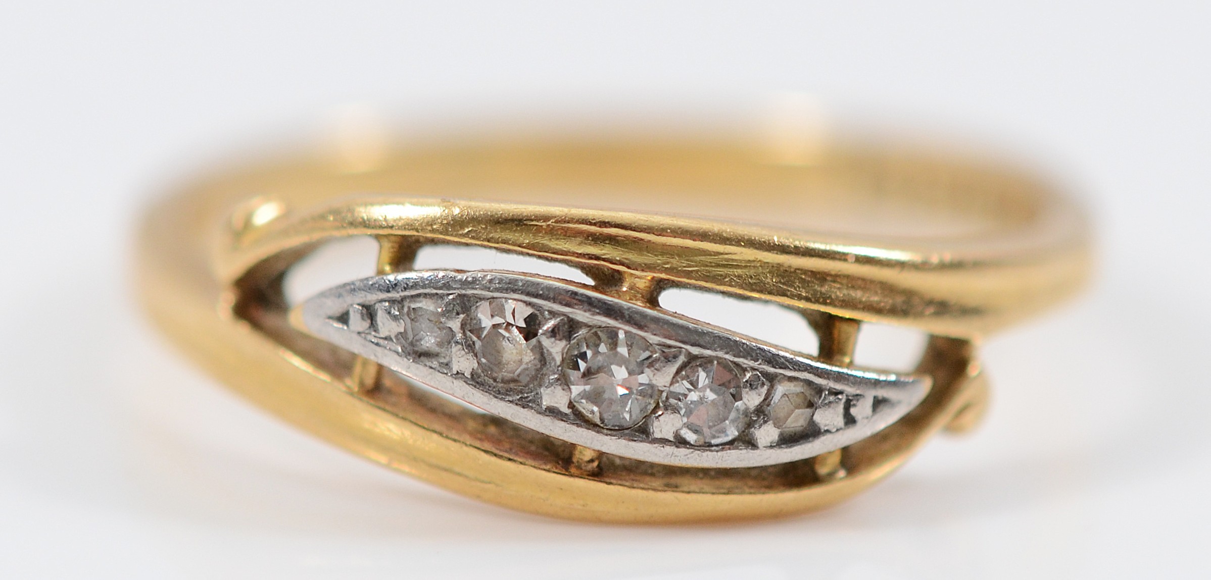 An 18ct gold old cut diamond five stone ring, stamped 18ct to the inner ...