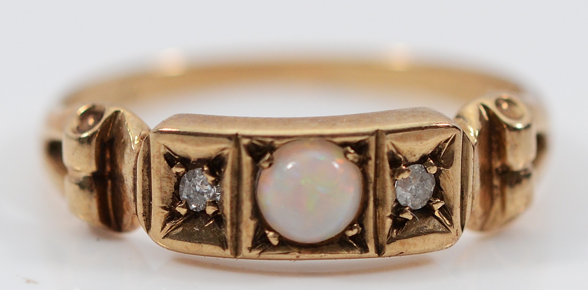 A 9ct gold opal and brilliant cut diamond three stone ring, hallmarks ...