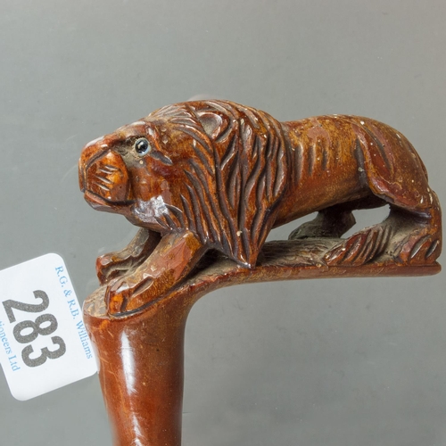 283 - FOUR WALKING STICKS INC 1 WITH CARVED LION TERMINAL & SILVER COLLAR