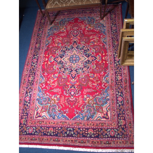 692 - RED GROUND IRANIAN RUG 290CM X 190CM