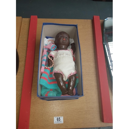 65 - Black baby papier mache doll