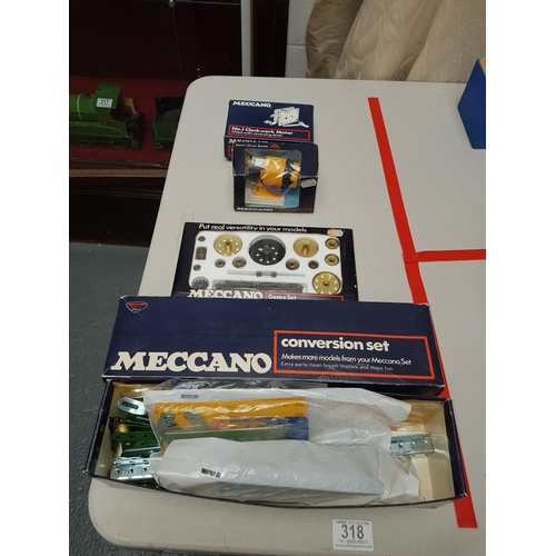 318 - Boxed Meccano items - clockwork motor, gear set, power drive unit and conversion set