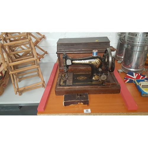 32 - Wooden cased hand Singer sewing machine