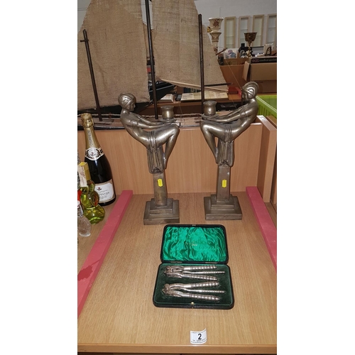 2 - Pair of Art Deco style brass candlesticks together with silver plated Walker and Hall nutcracker set