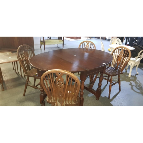 206 - Gateleg oak table and 4 chairs